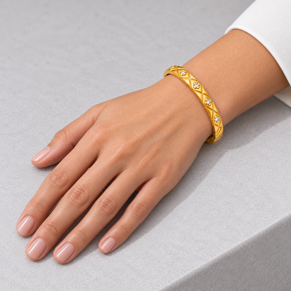 Elara Quilted Sparkle Bangle worn by a studio model