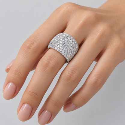 Studio close-up of the Aurelia pavé dome ring worn on a hand