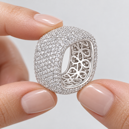 Hands presenting the Aurelia dome ring and floral openwork interior