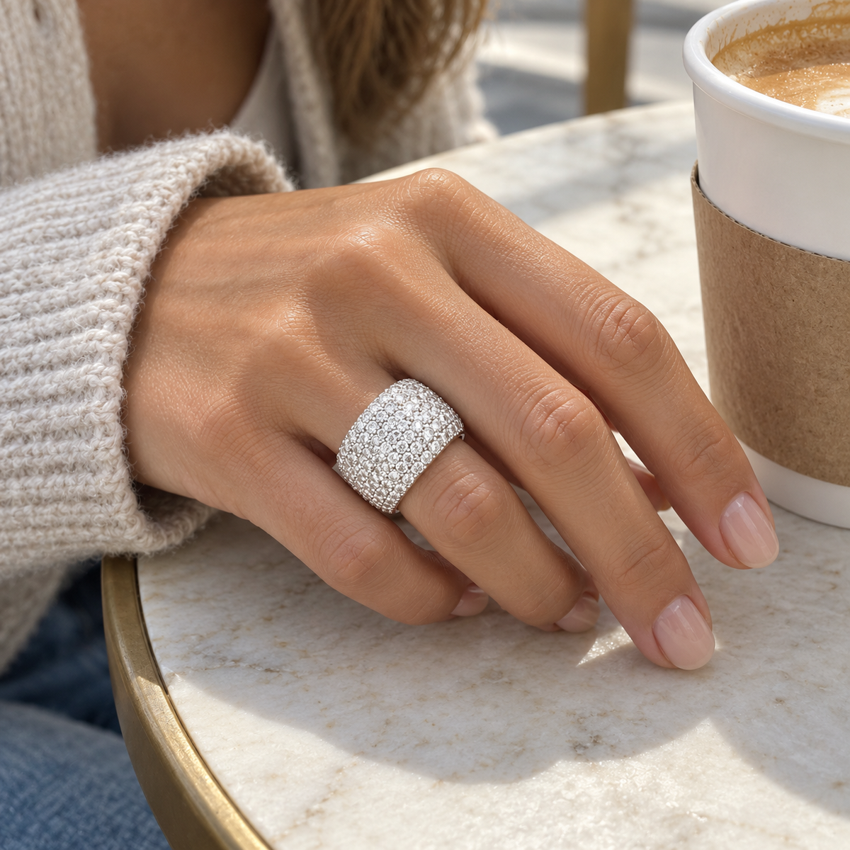 AI-generated lifestyle illustration of Aurelia Pavé Dome Ring – Moissanite Statement Band worn in an everyday setting.