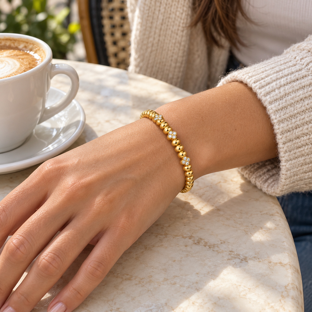 AI-generated lifestyle illustration of Solara Beaded Sparkle Bangle – Gold-Tone Moissanite worn in an everyday setting.