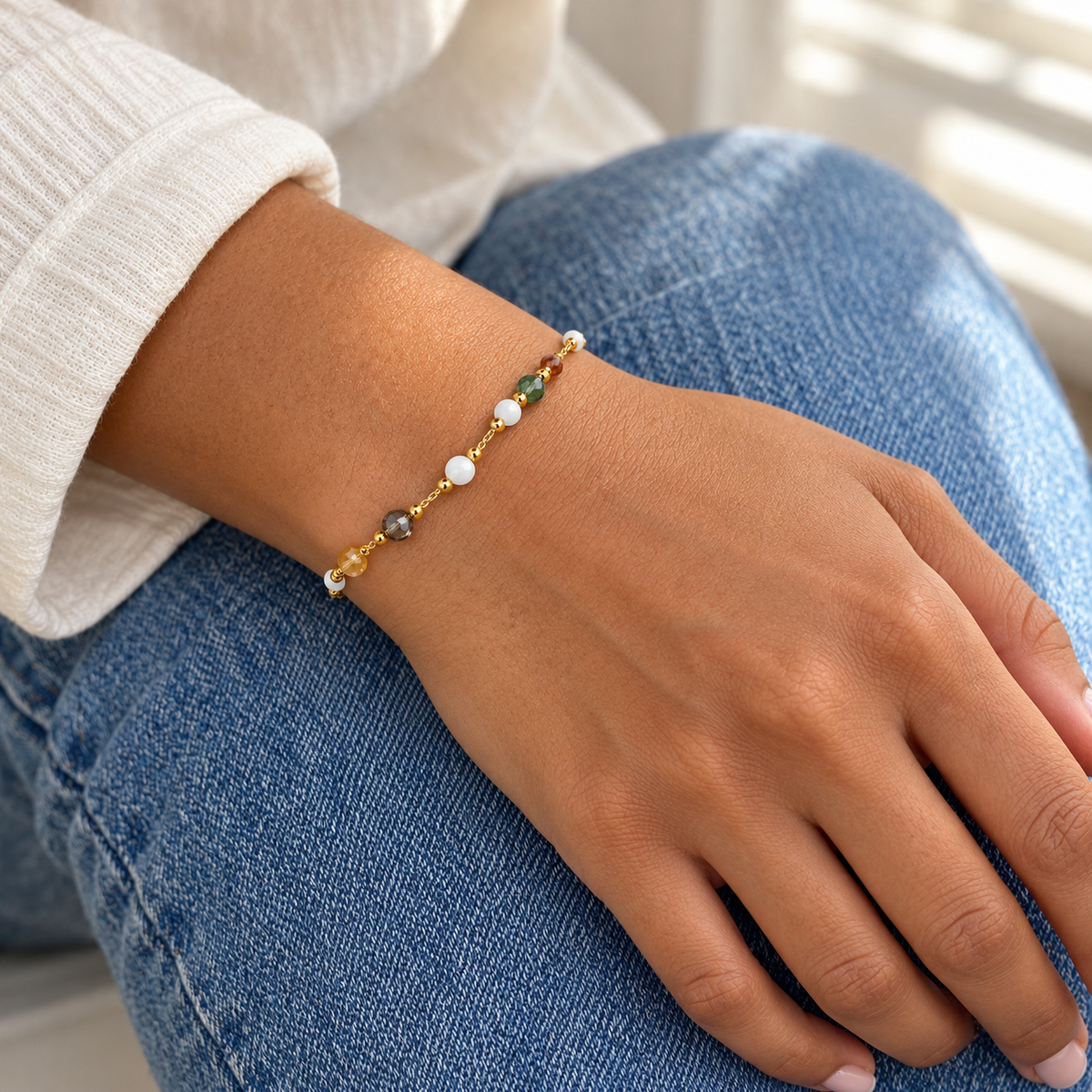 AI-generated lifestyle illustration of Prism Rainbow Beaded Bracelet – Gold-Tone worn in an everyday setting.