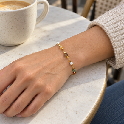 AI-generated lifestyle illustration of Prism Rainbow Beaded Bracelet – Gold-Tone worn in an everyday setting.
