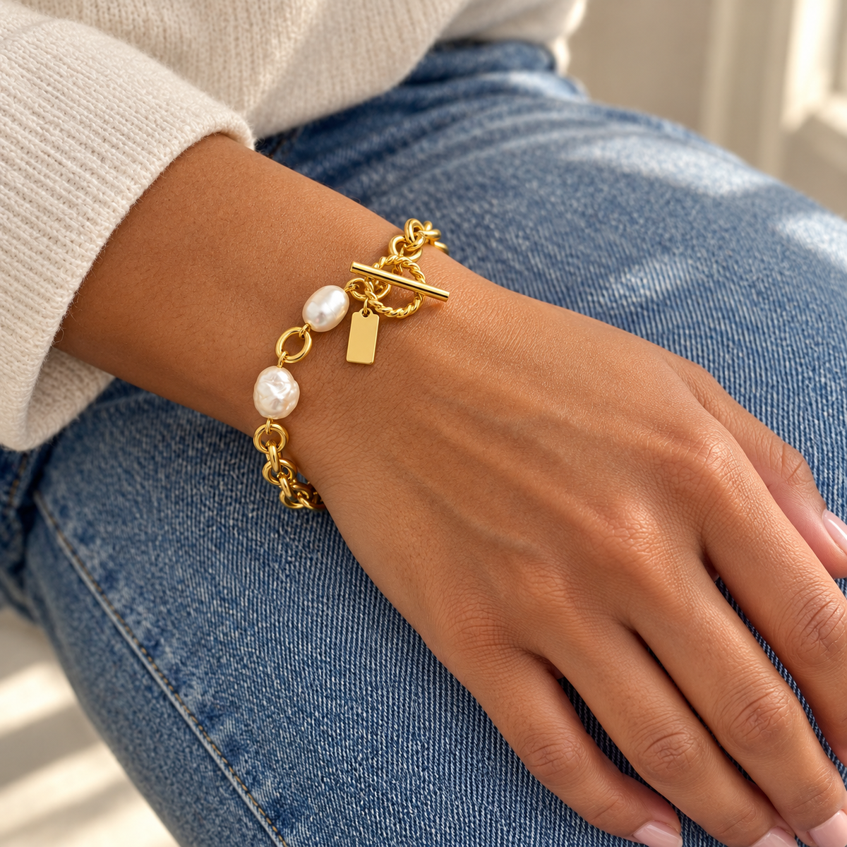 AI-generated lifestyle illustration of Marina Pearl-Look Toggle Bracelet – Gold-Tone worn in an everyday setting.