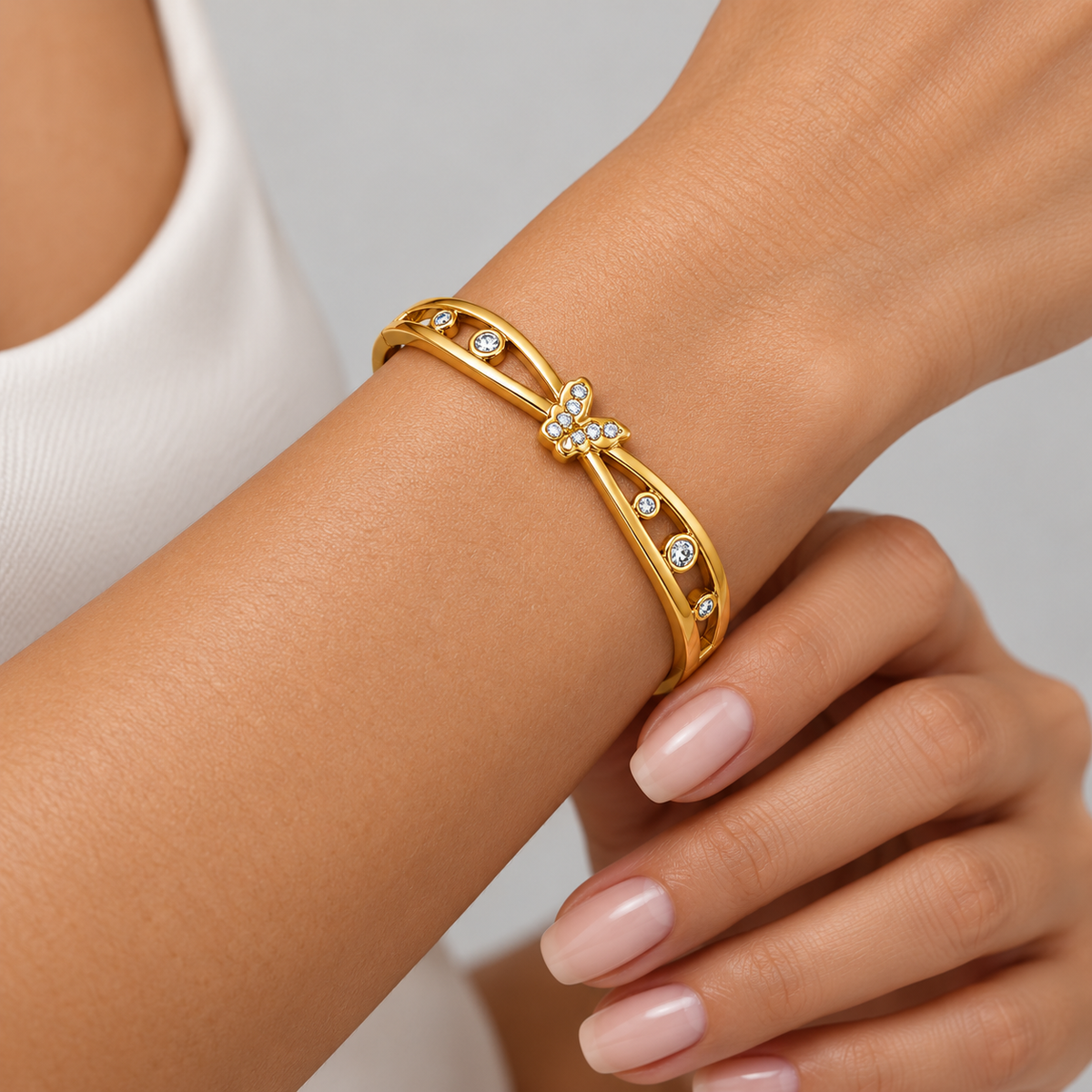 Celeste Butterfly Openwork Bangle worn by a studio model