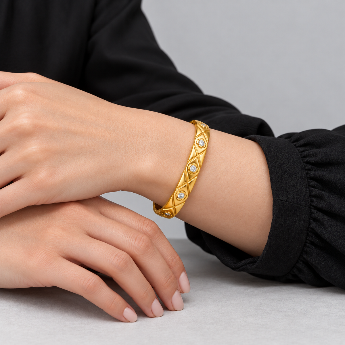 Elara Quilted Sparkle Bangle worn by a studio model