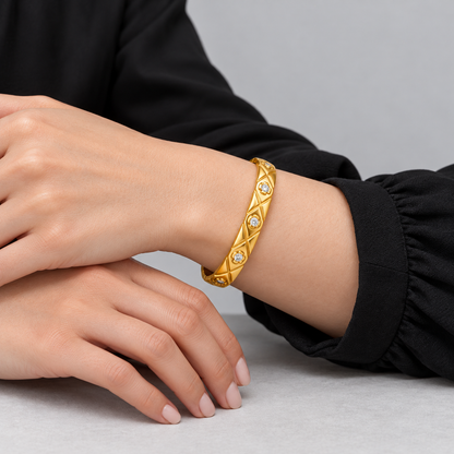 Elara Quilted Sparkle Bangle worn by a studio model