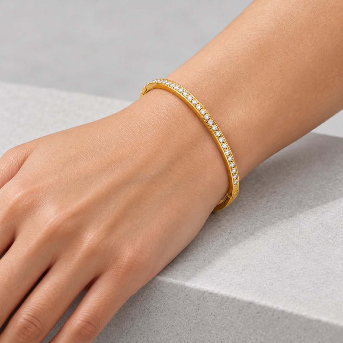Lumière Slim Pavé Bangle worn by a studio model