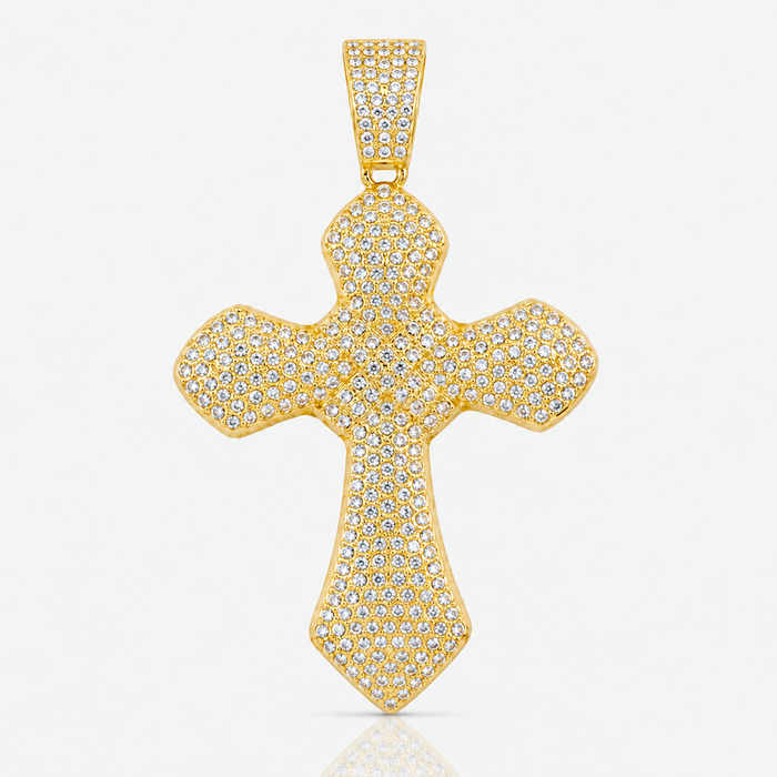 Gold-tone pavé cross pendant on a soft light gray studio background