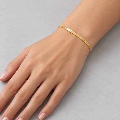 Serena Flat Snake Chain Bracelet shown on a model's wrist
