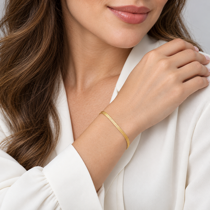 Serena Flat Snake Chain Bracelet shown on a model's wrist